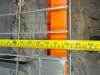 (1) 8' X 42" SECTION OF HEAVY-DUTY STEEL PALLET RACKING WITH ORANGE HORIZONTAL LOAD BEAMS, GREEN STEEL UPRIGHTS, AND WIRE DECKING. INCLUDES TWO ELEVATED STORAGE LEVELS WITH REMOVABLE STEEL WIRE DECK PANELS. - 2
