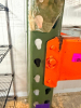 1) 8' X 42" SECTION OF HEAVY-DUTY STEEL PALLET RACKING WITH ORANGE HORIZONTAL LOAD BEAMS, GREEN STEEL UPRIGHTS, AND WIRE DECKING. INCLUDES TWO ELEVATED STORAGE LEVELS WITH REMOVABLE STEEL WIRE DECK PANELS. - 2
