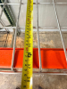 1) 8' X 42" SECTION OF HEAVY-DUTY STEEL PALLET RACKING WITH ORANGE HORIZONTAL LOAD BEAMS, GREEN STEEL UPRIGHTS, AND WIRE DECKING. INCLUDES TWO ELEVATED STORAGE LEVELS WITH REMOVABLE STEEL WIRE DECK PANELS. - 3