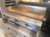 COOKRITE COMMERCIAL PROPANE COUNTERTOP GRIDDLE WITH STAINLESS STEEL BODY, 36" FLAT STEEL COOKING SURFACE, THREE INDEPENDENT BURNER CONTROLS, REAR AND SIDE SPLASH GUARDS, AND FRONT GREASE COLLECTION DRAWER. - 4