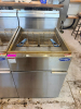 ATOSA FLOOR-MODEL PROPANE DEEP FRYER WITH STAINLESS STEEL EXTERIOR, DUAL FRY BASKETS, TUBE-TYPE BURNER SYSTEM, FRONT DRAIN VALVE, AND INTEGRATED SPLASH/BACKGUARD.