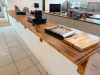 20' CUSTOM SOLID WOOD BUTCHER BLOCK COUNTERTOP SYSTEM WITH MULTIPLE CONNECTED SECTIONS, ROUNDED END SECTIONS, AND WALL-MOUNTED WOOD SUPPORT BRACKETS. COUNTERTOP FEATURES LAMINATED SOLID WOOD CONSTRUCTION WITH STAINED AND SEALED FINISH. INCLUDES MATCHING D - 4