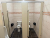 COMPLETE COMMERCIAL RESTROOM FIXTURE PACKAGE INCLUDING DOUBLE-SINK VANITY WITH SOLID SURFACE TOP, TWO INTEGRATED SINK BASINS, TWO FAUCETS, MIRROR, WALL-MOUNTED LIGHT FIXTURE, TWO WALL-MOUNTED URINALS, TWO TOILETS, TOILET/URINAL PARTITIONS, PAPER TOWEL DIS - 8