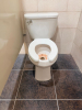 COMPLETE COMMERCIAL RESTROOM FIXTURE PACKAGE INCLUDING DOUBLE-SINK VANITY WITH SOLID SURFACE TOP, TWO INTEGRATED SINK BASINS, TWO FAUCETS, MIRROR, WALL-MOUNTED LIGHT FIXTURE, TWO WALL-MOUNTED URINALS, TWO TOILETS, TOILET/URINAL PARTITIONS, PAPER TOWEL DIS - 9