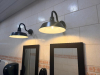 COMMERCIAL RESTROOM FIXTURE PACKAGE INCLUDING DOUBLE-SINK VANITY WITH WHITE SOLID SURFACE TOP, TWO UNDERMOUNT SINK BASINS, TWO BLACK FAUCETS, TWO FRAMED WALL MIRRORS, TWO BLACK WALL-MOUNTED LIGHT FIXTURES, TWO TOILETS, TOILET PARTITIONS, PAPER TOWEL DISPE - 5