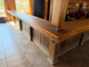 60'X 14' " U " SHAPED CUSTOM-BUILT U-SHAPED COMMERCIAL BAR WITH RUSTIC WOOD CONSTRUCTION, RAISED BAR TOP, LOWER WORK COUNTERS, EXTENSIVE BASE CABINETRY, DRAWERS, STORAGE COMPARTMENTS, DECORATIVE WOOD PANELS, HEAVY TIMBER POSTS, OVERHEAD WOOD BEAM/CANOPY S - 8