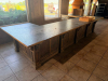 16' X 8'4" CUSTOM-BUILT COMMERCIAL SERVICE COUNTER WITH SOLID WOOD CABINETRY, RAISED PANEL DOORS, MULTIPLE DRAWERS, OPEN STORAGE SECTIONS, DECORATIVE TRIM, HEAVY WOOD BASE AND DARK TEXTURED COUNTERTOP WITH WOOD EDGE TRIM. COUNTER IS CONFIGURED IN A LARGE 