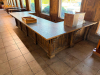 16' X 8'4" CUSTOM-BUILT COMMERCIAL SERVICE COUNTER WITH SOLID WOOD CABINETRY, RAISED PANEL DOORS, MULTIPLE DRAWERS, OPEN STORAGE SECTIONS, DECORATIVE TRIM, HEAVY WOOD BASE AND DARK TEXTURED COUNTERTOP WITH WOOD EDGE TRIM. COUNTER IS CONFIGURED IN A LARGE - 3