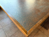 16' X 8'4" CUSTOM-BUILT COMMERCIAL SERVICE COUNTER WITH SOLID WOOD CABINETRY, RAISED PANEL DOORS, MULTIPLE DRAWERS, OPEN STORAGE SECTIONS, DECORATIVE TRIM, HEAVY WOOD BASE AND DARK TEXTURED COUNTERTOP WITH WOOD EDGE TRIM. COUNTER IS CONFIGURED IN A LARGE - 7