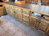 16' X 8'4" CUSTOM-BUILT COMMERCIAL SERVICE COUNTER WITH SOLID WOOD CABINETRY, RAISED PANEL DOORS, MULTIPLE DRAWERS, OPEN STORAGE SECTIONS, DECORATIVE TRIM, HEAVY WOOD BASE AND DARK TEXTURED COUNTERTOP WITH WOOD EDGE TRIM. COUNTER IS CONFIGURED IN A LARGE - 8