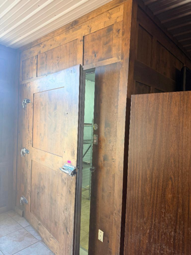 8' X 14' WALK-IN COOLER WITH INSULATED METAL PANEL CONSTRUCTION, HEAVY WOOD-FACED INSULATED ENTRY DOOR, CEILING-MOUNTED THREE-FAN EVAPORATOR, REFRIGERATION PIPING AND REMOTE OUTDOOR CONDENSING UNIT. INTERIOR INCLUDES WALL-MOUNTED BEVERAGE/DISPENSING LINES