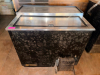 TRUE HORIZONTAL SLIDING-LID BOTTLE COOLER WITH STAINLESS STEEL TOP, TWO SLIDING LIDS, INTERIOR DIVIDERS AND SELF-CONTAINED REFRIGERATION SYSTEM.