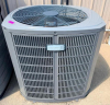 AMERICAN STANDARD OUTDOOR AIR CONDITIONING CONDENSING UNIT WITH TOP-MOUNTED FAN, PROTECTIVE COIL CABINET, AND SINGLE COMPRESSOR SYSTEM.