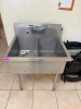 STAINLESS STEEL TWO-COMPARTMENT SINK WITH DEEP BASINS, INTEGRAL BACKSPLASH, DECK-MOUNTED FAUCET ASSEMBLY WITH FLEXIBLE SPRAY HOSE, DRAIN FITTINGS, AND FOUR STAINLESS STEEL LEGS. - 2