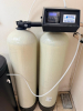 BAUMAN DUAL-TANK WATER SOFTENER SYSTEM WITH TWO FIBERGLASS MINERAL TANKS, SEPARATE BRINE TANK, AUTOMATIC DIGITAL CONTROL VALVE, INTERCONNECTING PLUMBING, AND BRINE LINE. - 2