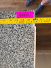 130" SPECKLED GRANITE COUNTERTOP AND MATCHING GRANITE BACKSPLASH. WHITE SHAKER-STYLE CABINETRY INCLUDES MULTIPLE DRAWERS, DOUBLE-DOOR STORAGE COMPARTMENTS, ADJUSTABLE/REMOVABLE INTERIOR SHELVING, AND DARK METAL PULL HARDWARE - 2