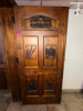 72" WIDE X 80"SOLID WOOD PANEL DOUBLE DOOR WITH DARK STAINED FINISH AND DECORATIVE ROUTED/RAISED PANELS. FEATURES CUSTOM &ldquo;BREWING CO. & DISTILLING&rdquo; GRAPHIC, WHEAT/BARLEY, TRACTOR, BUILDING, AND STATE-SHAPED DECORATIVE DESIGNS INSET INTO THE DOOR. HEAVY-DU - 2