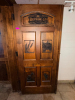 72" WIDE X 80"SOLID WOOD PANEL DOUBLE DOOR WITH DARK STAINED FINISH AND DECORATIVE ROUTED/RAISED PANELS. FEATURES CUSTOM &ldquo;BREWING CO. & DISTILLING&rdquo; GRAPHIC, WHEAT/BARLEY, TRACTOR, BUILDING, AND STATE-SHAPED DECORATIVE DESIGNS INSET INTO THE DOOR. HEAVY-DU - 3