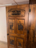 72" WIDE X 80"SOLID WOOD PANEL DOUBLE DOOR WITH DARK STAINED FINISH AND DECORATIVE ROUTED/RAISED PANELS. FEATURES CUSTOM &ldquo;BREWING CO. & DISTILLING&rdquo; GRAPHIC, WHEAT/BARLEY, TRACTOR, BUILDING, AND STATE-SHAPED DECORATIVE DESIGNS INSET INTO THE DOOR. HEAVY-DU - 7