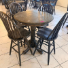 36" ROUND COUNTER-HEIGHT WOOD PEDESTAL TABLE WITH FOUR MATCHING WINDSOR-BACK WOOD CHAIRS. TABLE FEATURES A THICK ROUND TOP, TURNED CENTER PEDESTAL, AND FOUR-FOOT BASE. CHAIRS FEATURE TALL SPINDLE BACKS, SOLID WOOD SEATS, FOOTREST/STRETCHER SUPPORTS, AND D