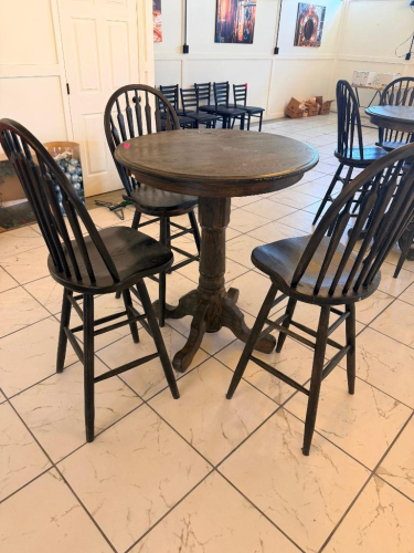 36" ROUND COUNTER-HEIGHT WOOD PEDESTAL TABLE WITH FOUR MATCHING WINDSOR-BACK WOOD CHAIRS. TABLE FEATURES A THICK ROUND TOP, TURNED CENTER PEDESTAL, AND FOUR-FOOT BASE. CHAIRS FEATURE TALL SPINDLE BACKS, SOLID WOOD SEATS, FOOTREST/STRETCHER SUPPORTS, AND D