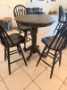 36" ROUND COUNTER-HEIGHT WOOD PEDESTAL TABLE WITH FOUR MATCHING WINDSOR-BACK WOOD CHAIRS. TABLE FEATURES A THICK ROUND TOP, TURNED CENTER PEDESTAL, AND FOUR-FOOT BASE. CHAIRS FEATURE TALL SPINDLE BACKS, SOLID WOOD SEATS, FOOTREST/STRETCHER SUPPORTS, AND D - 2