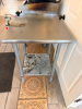 24" W X 24" STAINLESS STEEL WORK TABLE WITH GALVANIZED TUBULAR LEGS, LOWER UNDERSHELF, REAR AND SIDE EDGE GUARDS, AND ATTACHED MANUAL HEAVY-DUTY CAN OPENER WITH ADJUSTABLE VERTICAL POST AND OPERATING HANDLE - 2