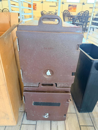 (2) COMMERCIAL INSULATED FRONT-LOADING FOOD PAN CARRIERS WITH MOLDED BROWN EXTERIORS, HINGED FRONT DOORS, RECESSED LATCHES, INTEGRATED CARRY HANDLES, AND STACKABLE CONSTRUCTION.