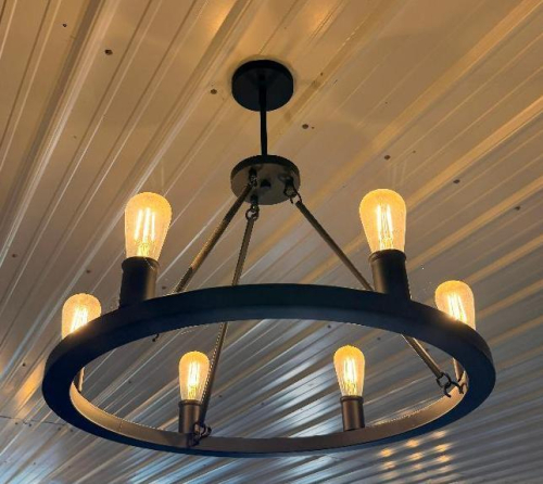 (2) ROUND BLACK METAL RING CHANDELIER WITH (6) EXPOSED EDISON-STYLE BULBS, CIRCULAR FRAME, AND THREE-POINT SUSPENSION SUPPORT.