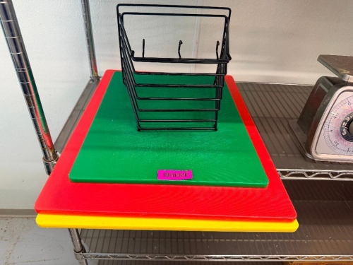 (3) ASSORTED PLASTIC CUTTING BOARDS WITH BLACK HOLDER