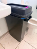 (1) BLACK TRASH CAN WITH LID
