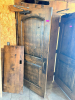 SOLID CORE WOOD DOOR WITH STAINED FINISH, ARCHED RAISED PANEL DESIGN, HEAVY-DUTY HINGES, METAL PULL HANDLE, AND OVERHEAD HYDRAULIC DOOR CLOSER.