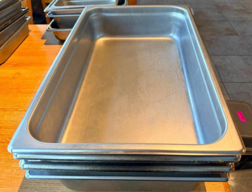 (4) FULL SIZE STAINLESS INSERTS.