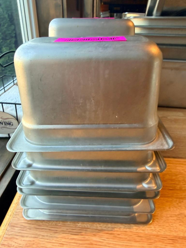 (6) 1/9TH SIZE STAINLESS INSERTS.