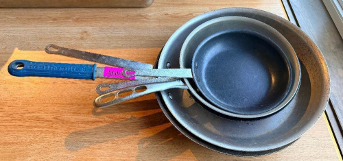 (4) ASSORTED SKILLETS.