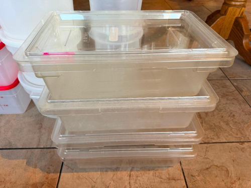 (4) FULL SIZE PLASTIC CONTAINERS W/ LIDS.