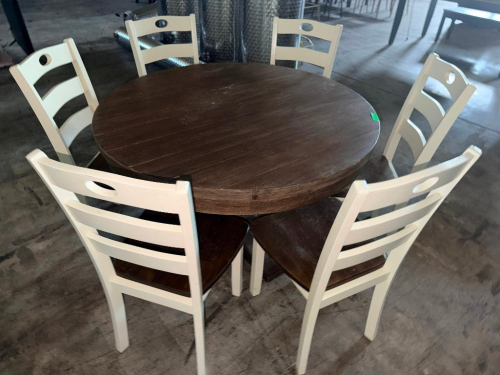 7-PIECE ROUND DINING SET CONSISTING OF (1) ROUND WOOD DINING TABLE AND (6) MATCHING LADDER-BACK DINING CHAIRS. TABLE FEATURES A DARK BROWN WOOD FINISH WITH PLANK-STYLE TOP. CHAIRS FEATURE WHITE FINISHED FRAMES, LADDER BACKS WITH OVAL CUTOUTS, AND CONTRAST