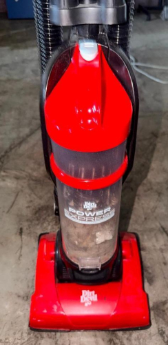 DIRT DEVIL POWER EXPRESS UPRIGHT BAGLESS VACUUM CLEANER WITH CLEAR DIRT CUP, FLOOR HEAD, UPRIGHT HANDLE, AND INTEGRATED FLEXIBLE HOSE. RED AND BLACK FINISH.