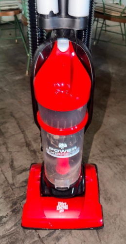 DIRT DEVIL POWER EXPRESS UPRIGHT BAGLESS VACUUM CLEANER WITH CLEAR DIRT CUP, FLOOR HEAD, UPRIGHT HANDLE, AND INTEGRATED FLEXIBLE HOSE. RED AND BLACK FINISH.