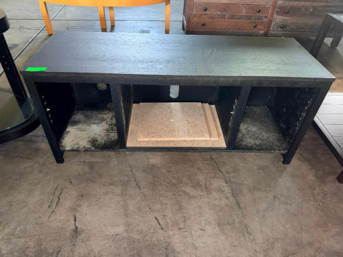 BLACK WOOD/WOOD-COMPOSITE TV STAND OR MEDIA CONSOLE WITH RECTANGULAR TOP, OPEN FRONT STORAGE COMPARTMENTS, ADJUSTABLE SHELF PIN HOLES, AND REAR CABLE MANAGEMENT OPENINGS.