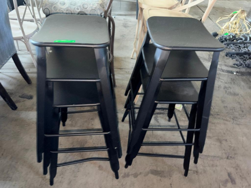 (6) BLACK WOOD BAR STOOLS WITH SQUARE SEATS, FOUR-LEG CONSTRUCTION, AND INTEGRATED FOOTREST/STRETCHER BARS.