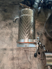 (3) STAINLESS STEEL VARIABLE-CAPACITY STORAGE / PROCESSING TANKS WITH (2) ADDITIONAL STAINLESS STEEL CYLINDRICAL VESSEL ASSEMBLIES. MAIN TANKS FEATURE DIMPLED / DECORATIVE STAINLESS EXTERIORS, REMOVABLE TOP LIDS, MULTIPLE SANITARY PORTS, BOTTOM OUTLET VAL - 4