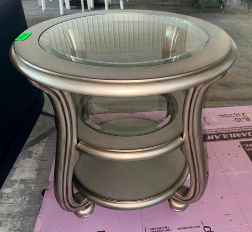 ROUND GLASS-TOP ACCENT TABLE WITH SILVER-TONE FINISH, CURVED SUPPORT LEGS, INSET GLASS TOP, CIRCULAR GLASS CENTER SHELF, AND LOWER ROUND SHELF.