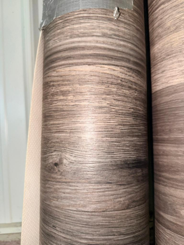 (2) LARGE ROLLS OF WOOD-GRAIN PATTERN SHEET MATERIAL WITH BROWN AND GRAY WOOD-GRAIN FINISH.