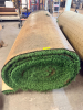 7.5' W X 40' L ARTIFICIAL TURF / ASTROTURF WITH GREEN SYNTHETIC GRASS SURFACE AND WOVEN BACKING. TURF IS ROLLED FOR STORAGE AND SHOWS VISIBLE DIRT, WEAR, FRAYING, AND RESIDUE CONSISTENT WITH PREVIOUS INSTALLATION AND REMOVAL.
