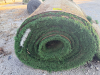 7.5' W X 40' L ARTIFICIAL TURF / ASTROTURF WITH GREEN SYNTHETIC GRASS SURFACE AND WOVEN BACKING. TURF IS ROLLED FOR STORAGE AND SHOWS VISIBLE DIRT, WEAR, FRAYING, AND RESIDUE CONSISTENT WITH PREVIOUS INSTALLATION AND REMOVAL. - 2