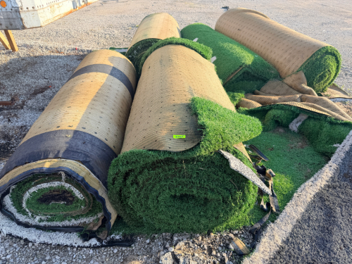 (7) ASSORTED ROLLS OF 7.5' W X 40' L ARTIFICIAL TURF / ASTROTURF WITH GREEN SYNTHETIC GRASS SURFACE AND WOVEN BACKING. TURF IS ROLLED FOR STORAGE AND SHOWS VISIBLE DIRT, WEAR, FRAYING, AND RESIDUE CONSISTENT WITH PREVIOUS INSTALLATION AND REMOVAL.