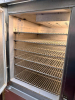 MCCALL FOUR-DOOR COMMERCIAL REACH-IN REFRIGERATOR WITH STAINLESS STEEL EXTERIOR, FOUR SOLID HINGED DOORS, ADJUSTABLE WIRE SHELVING, TOP-MOUNTED REFRIGERATION SYSTEM, AND BUILT-IN TEMPERATURE GAUGE - 3