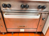 VULCAN COMMERCIAL SIX-BURNER NATURAL GAS RANGE WITH STANDARD OVEN BASE, HEAVY-DUTY CAST IRON OPEN-TOP GRATES, INDIVIDUAL BURNER CONTROLS, STAINLESS STEEL FRONT, BACKSPLASH, OVEN RACK, AND CASTERS. - 4