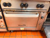VULCAN COMMERCIAL SIX-BURNER NATURAL GAS RANGE WITH STANDARD OVEN BASE, HEAVY-DUTY CAST IRON OPEN-TOP GRATES, INDIVIDUAL BURNER CONTROLS, STAINLESS STEEL FRONT, BACKSPLASH, OVEN RACK, AND CASTERS. - 3